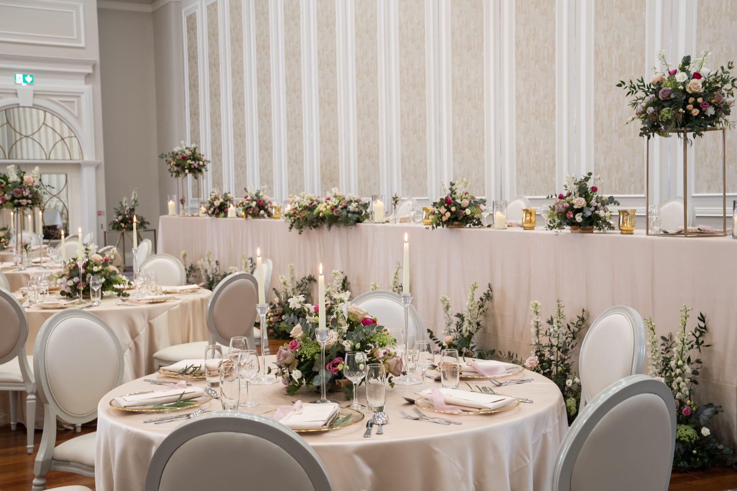 A floral and blush wedding setup at Tullyglass House Hotel with photography services by Rapid Agency
