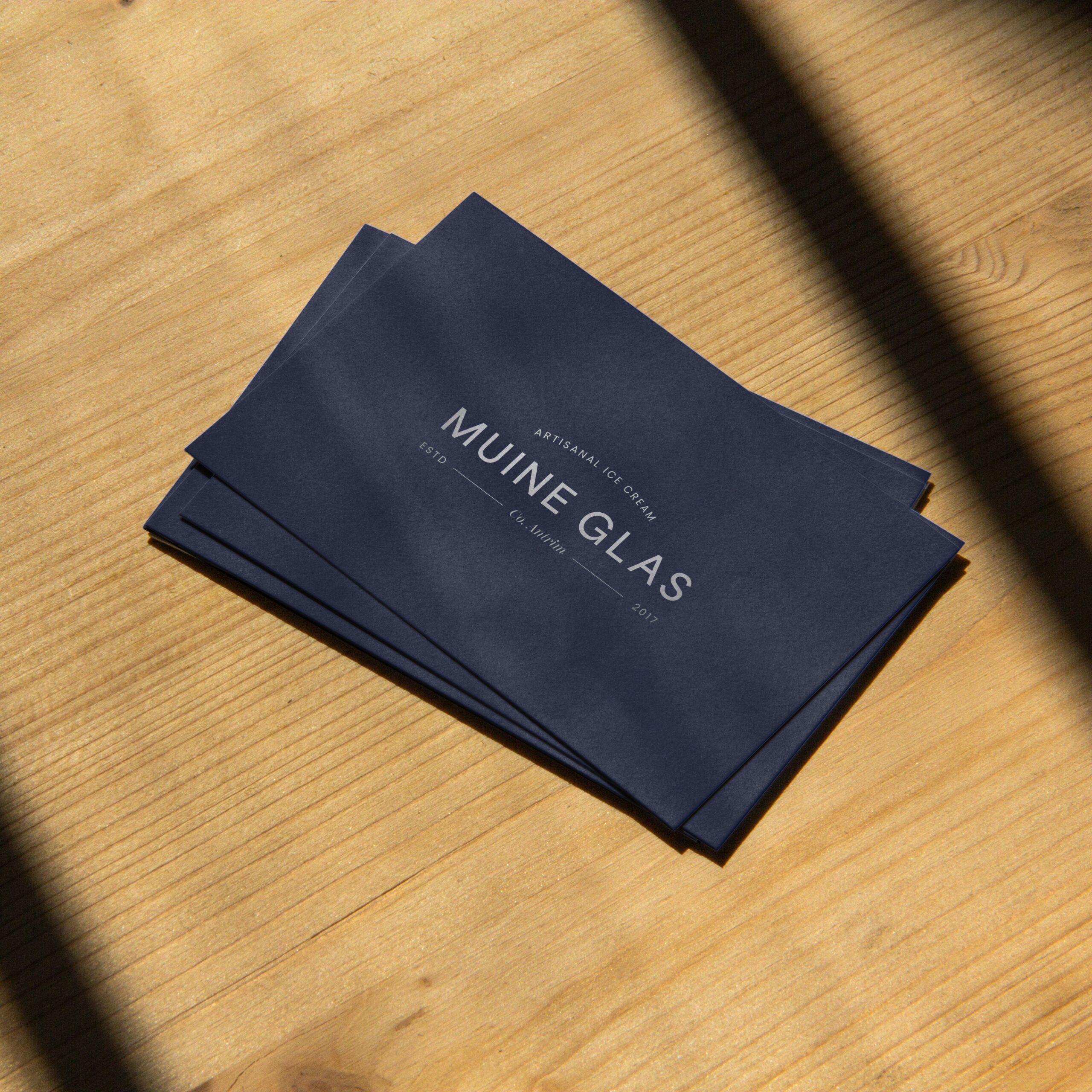 Muine Glas navy and white business card design