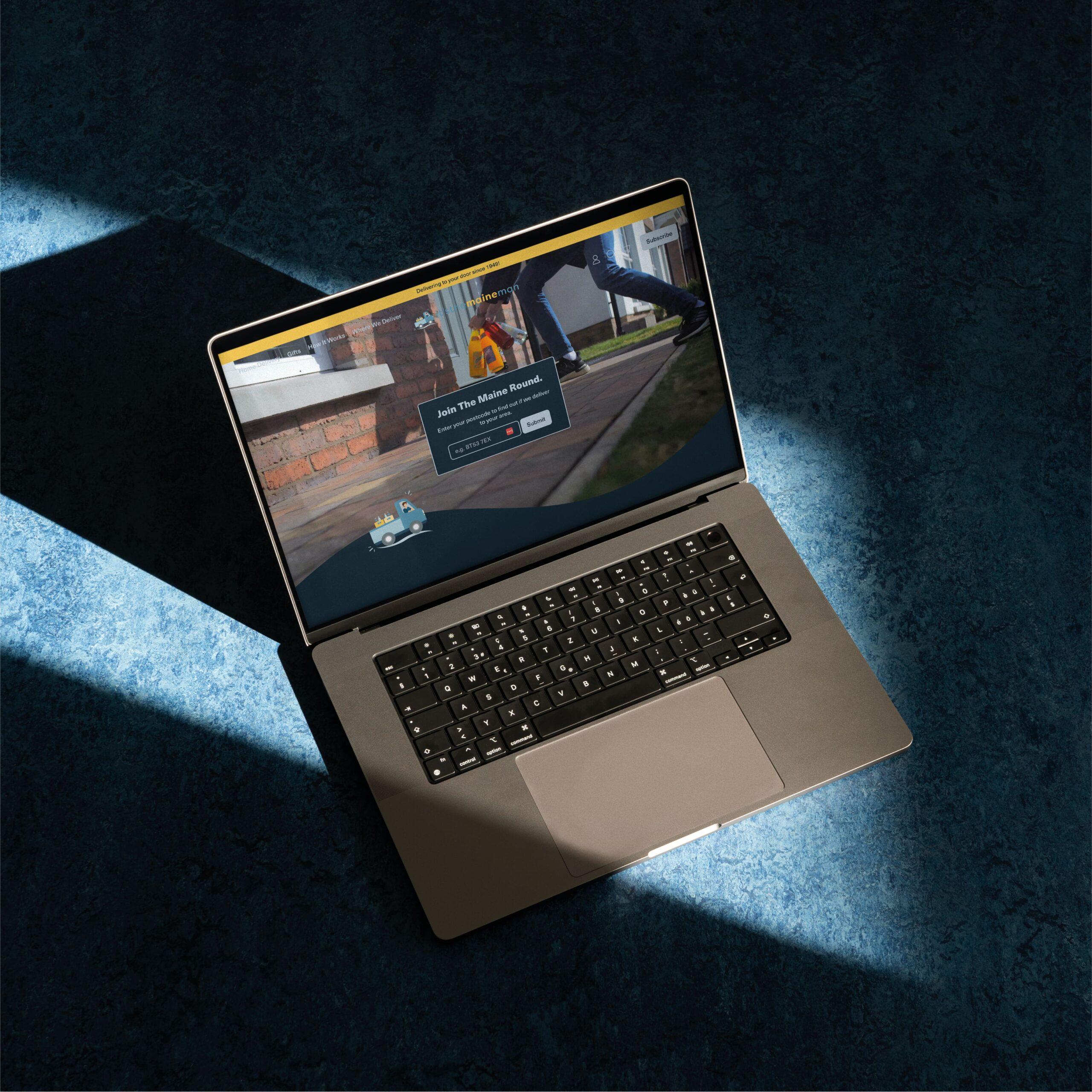 Laptop with mockup of Its the Maine Man website created by Rapid Agency in Belfast